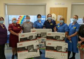 staff with tvs for childrens ward